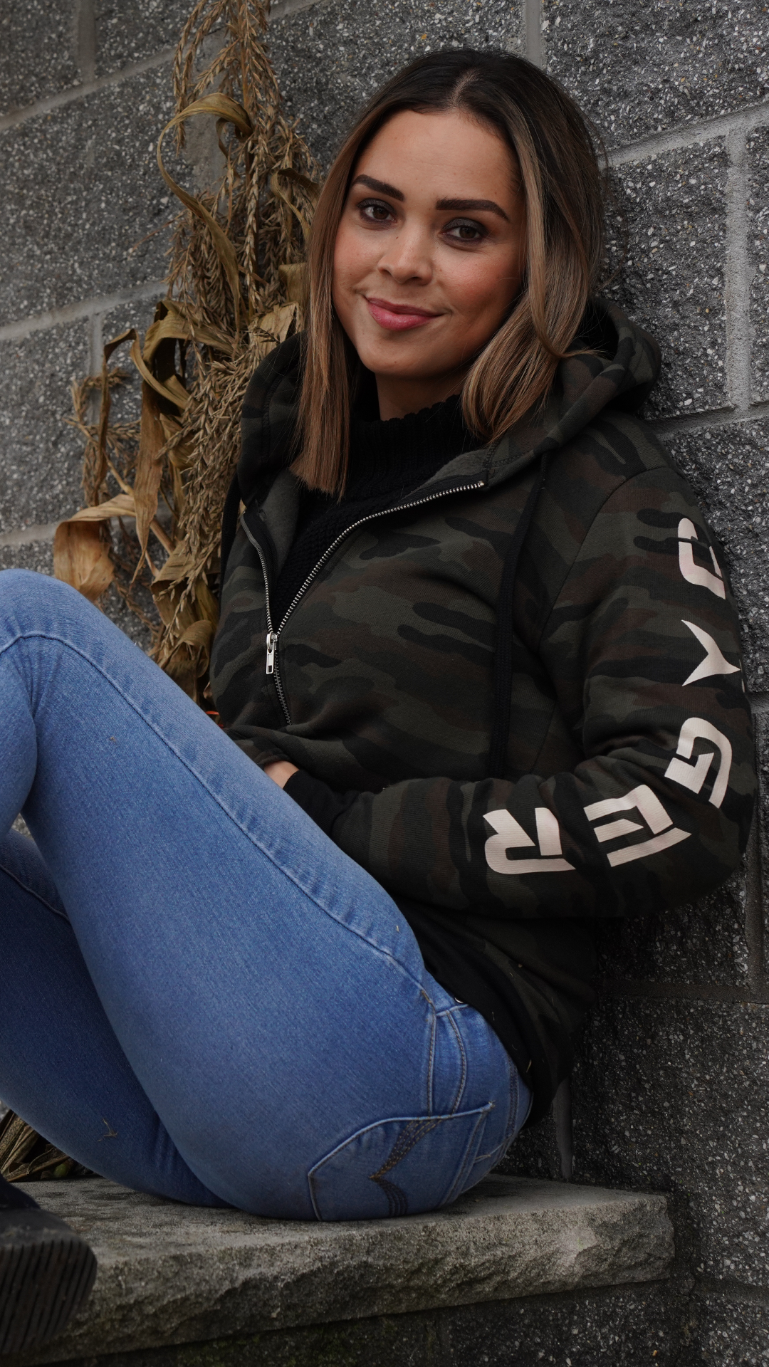FEMALE WEARING TACTICAL CAMOUFLAGE HOODIE
